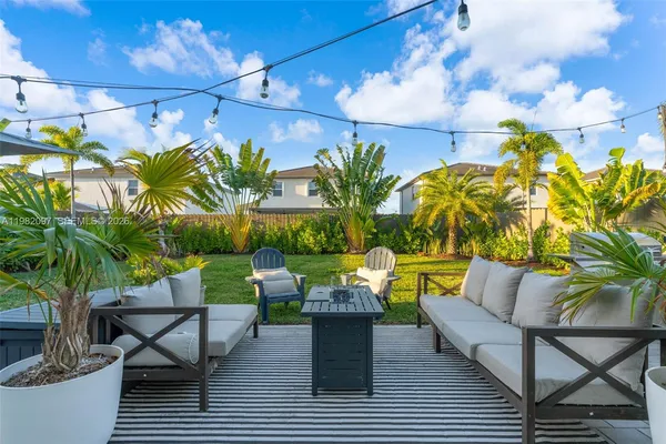 a view of a chairs and table in the patio