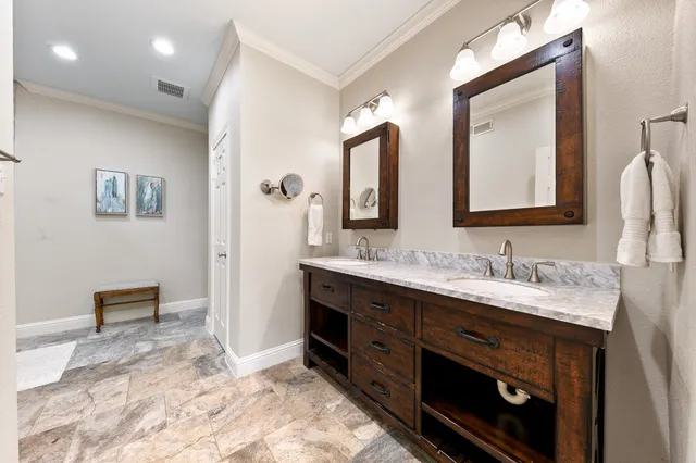 a living room with furniture a fireplace and a large window