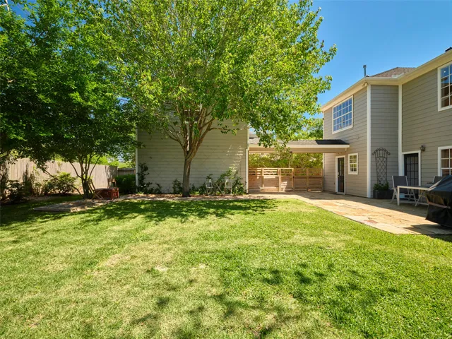 a dining room with furniture a chandelier and wooden floor