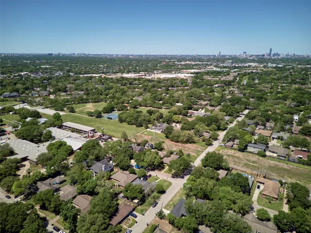 an aerial view of house with yard