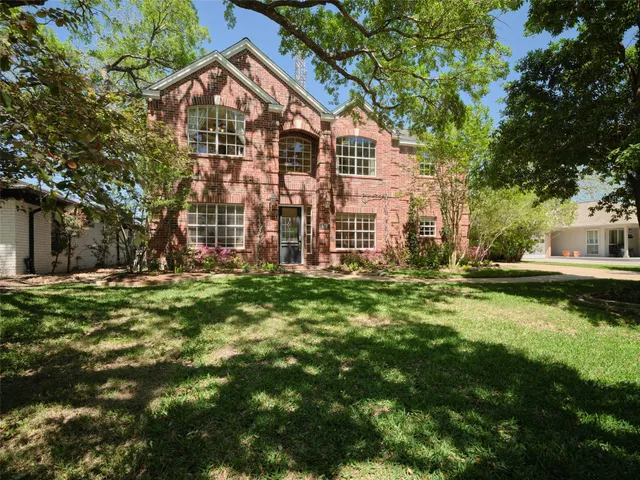 a view of a lake with a yard