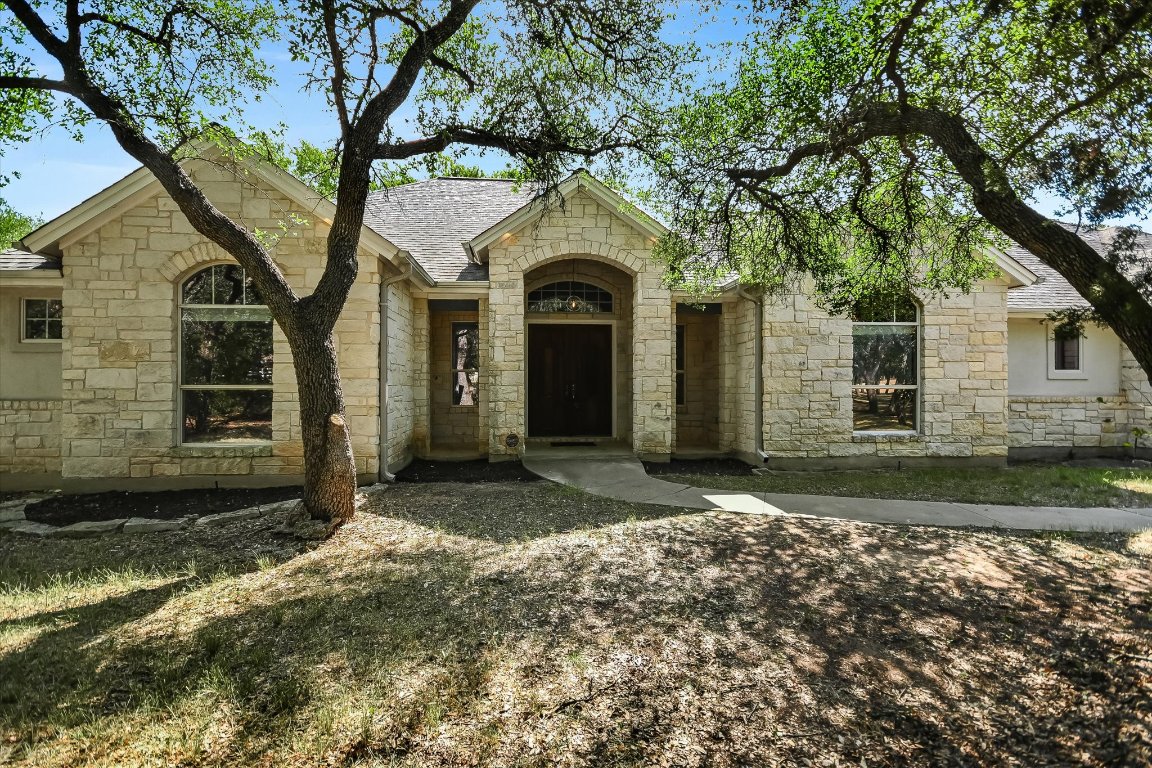 112 Twin Saddles Dripping Springs, TX 78620 - Photo 1 of 29 a front view of a house with garden