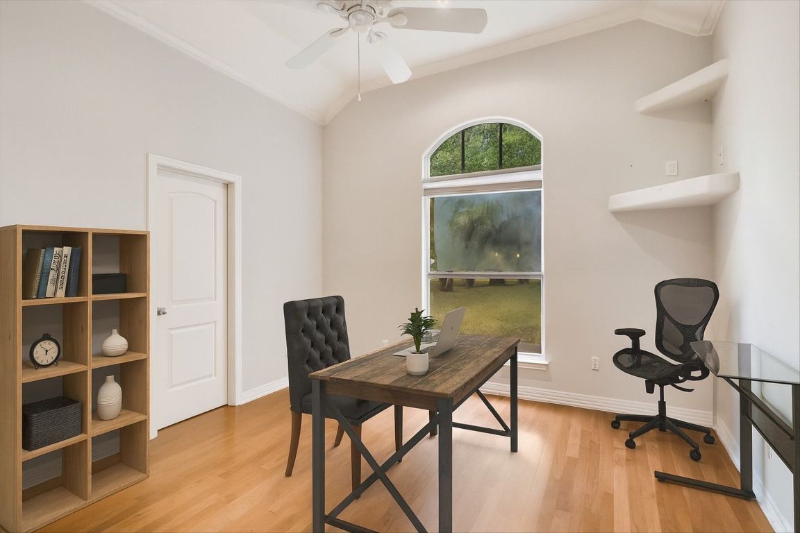 112 Twin Saddles Dripping Springs, TX 78620 - Photo 12 of 29 a workspace with furniture and wooden floor