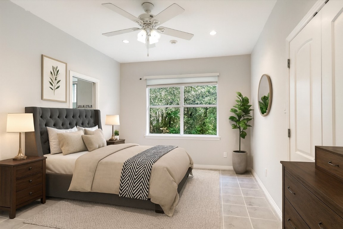 112 Twin Saddles Dripping Springs, TX 78620 - Photo 20 of 29 a bedroom with a large bed and a window