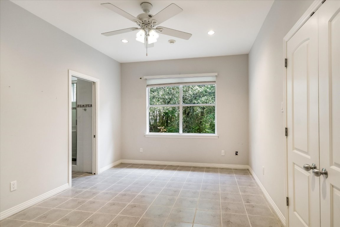 112 Twin Saddles Dripping Springs, TX 78620 - Photo 21 of 29 a view of an empty room with a window