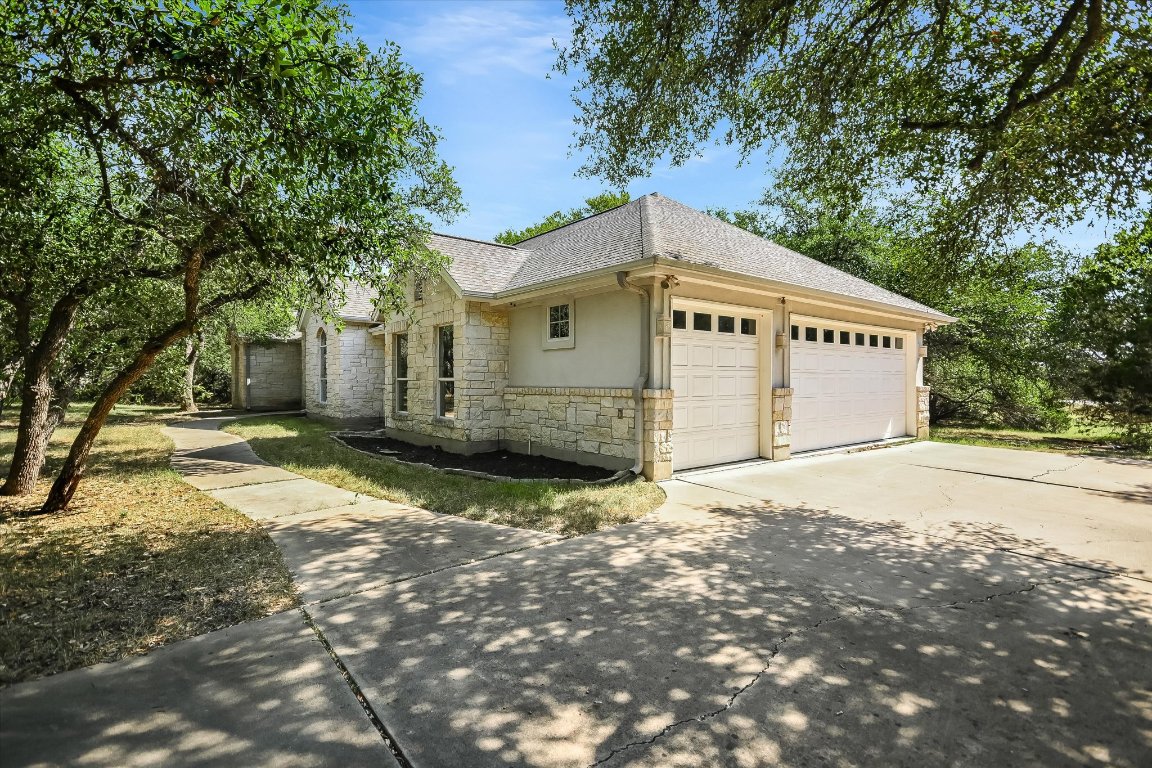 112 Twin Saddles Dripping Springs, TX 78620 - Photo 27 of 29 a view of a house with a yard