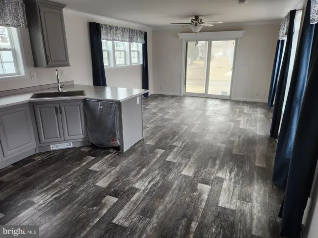 a view of a kitchen from the hallway