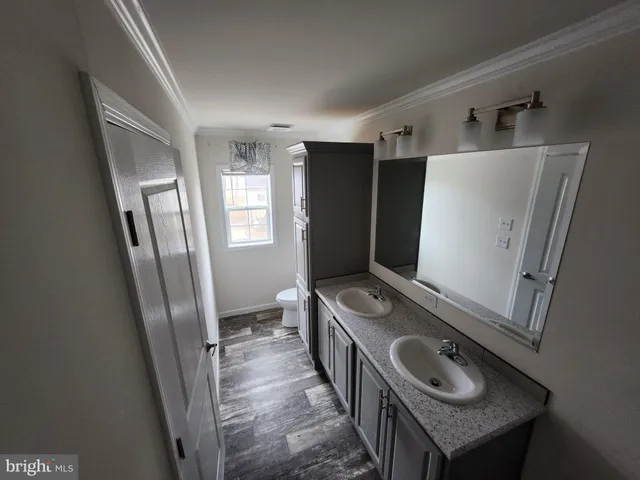 a room with stainless steel appliances washer and dryer