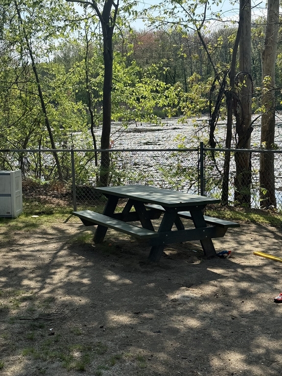 310 Codman Hill Road, Unit 34D Boxborough, MA 01719 - Photo 5 of 17 a view of a backyard with sitting area