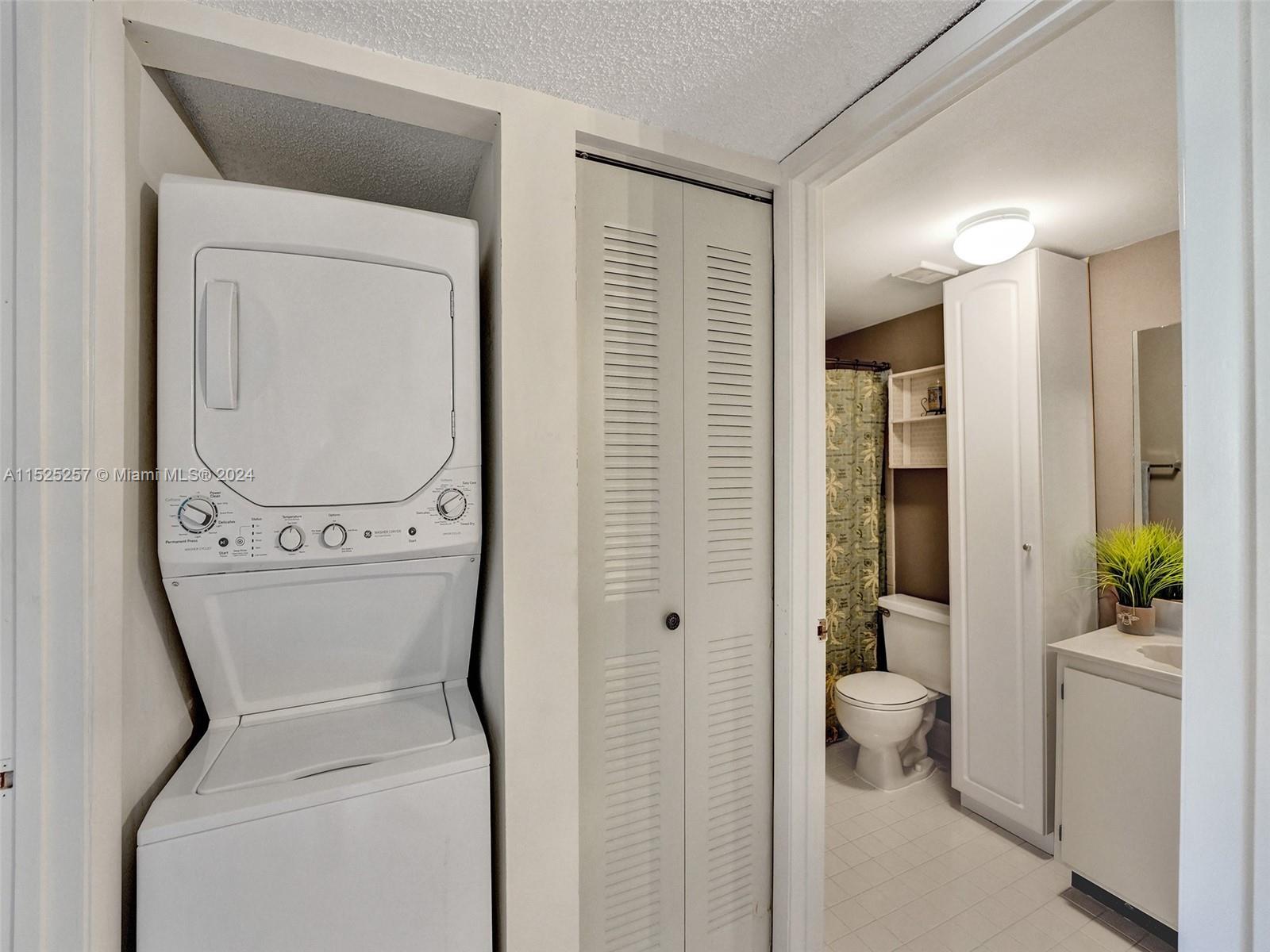 9480 Boca Cove Circle, Unit 416 Boca Raton, FL 33428 - Photo 14 of 25 a bathroom with a toilet and a shower