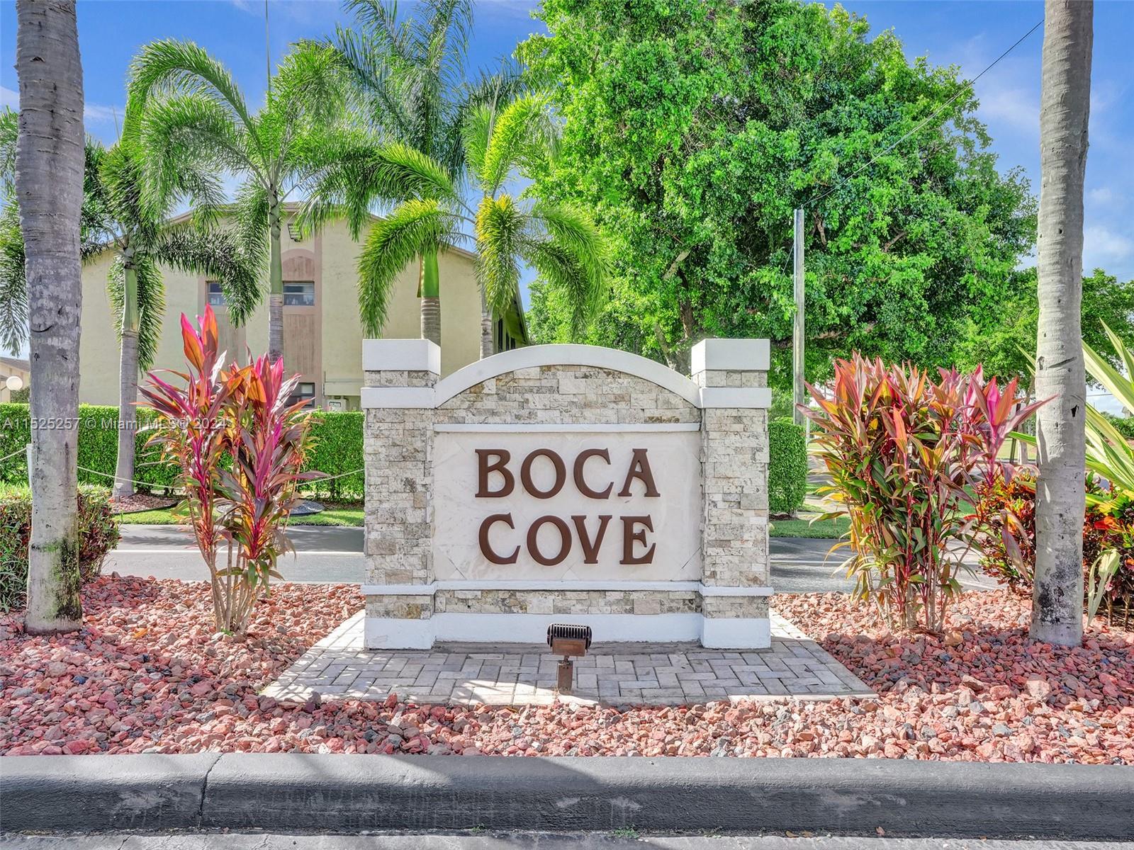 9480 Boca Cove Circle, Unit 416 Boca Raton, FL 33428 - Photo 25 of 25 a sign that is on the side of a road