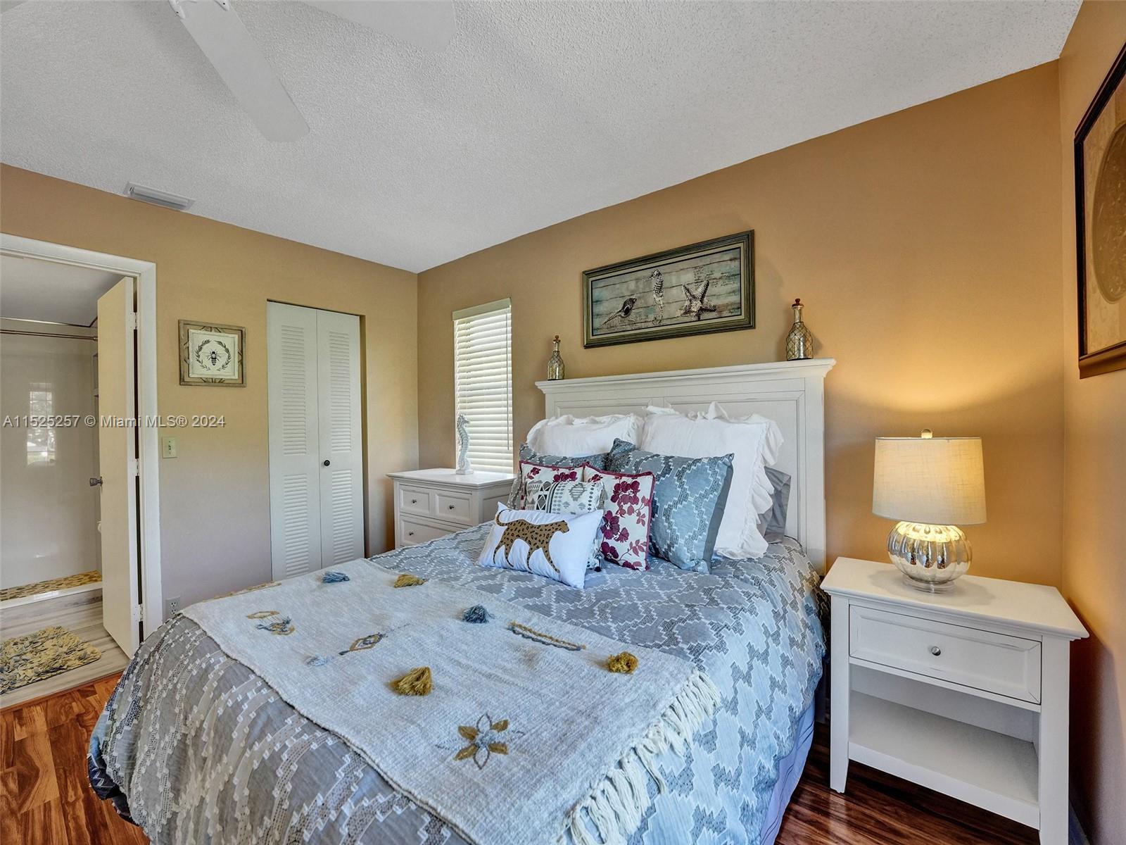 9480 Boca Cove Circle, Unit 416 Boca Raton, FL 33428 - Photo 10 of 25 a bed room with a bed and a dresser