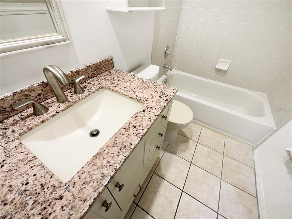 605 Sand Ridge Drive Valrico, FL 33594 - Photo 16 of 26 a bathroom with a sink and a toilet