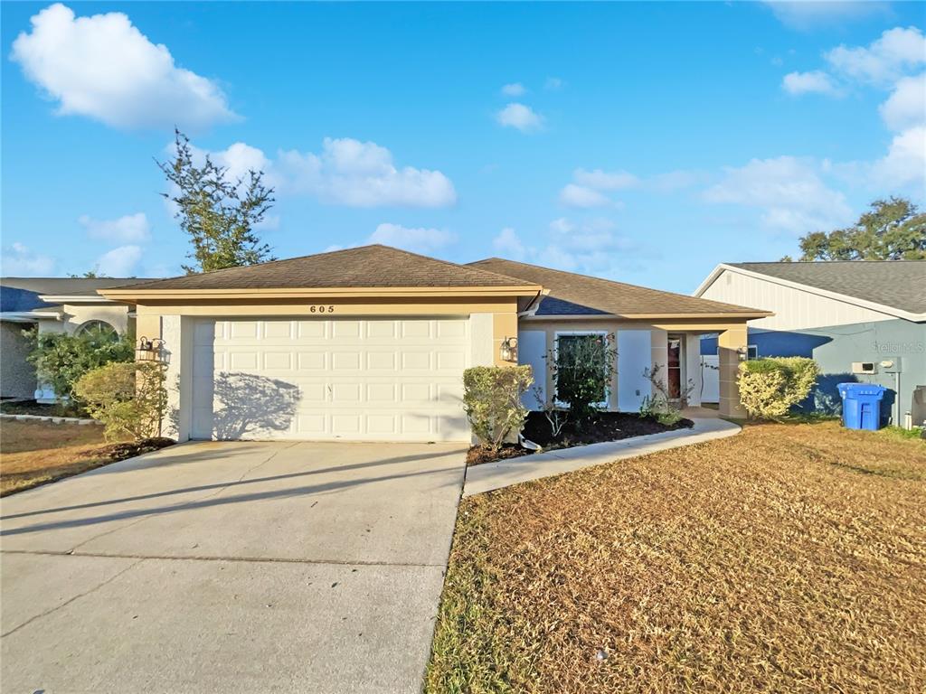 605 Sand Ridge Drive Valrico, FL 33594 - Photo 23 of 26 a view of a house with sitting area and garden