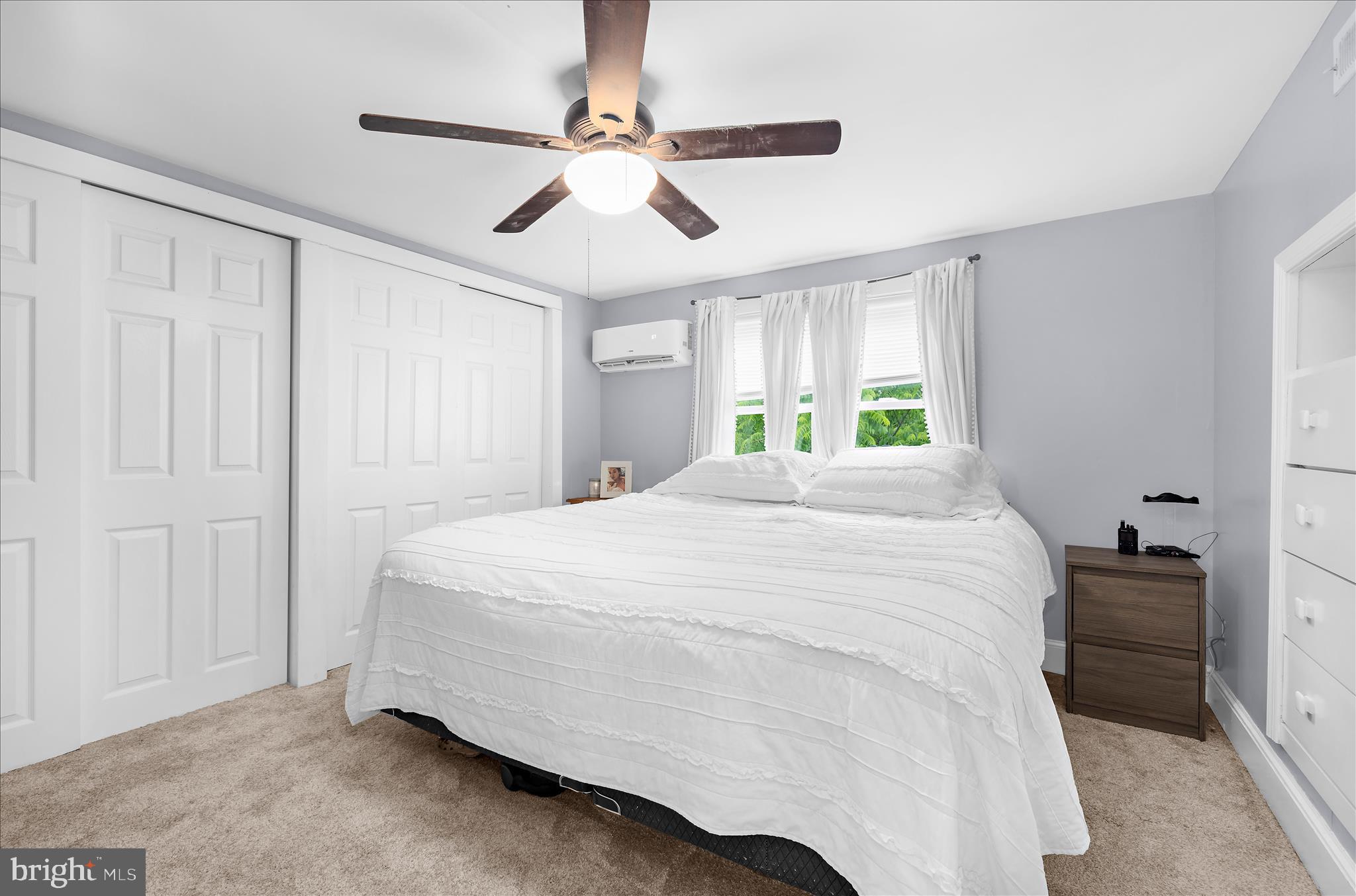 11994 Cordova Road Cordova, MD 21625 - Photo 28 of 57 a spacious bedroom with a bed and a chandelier
