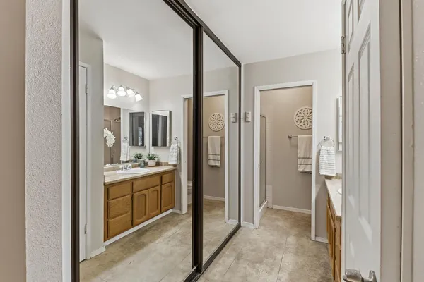 a view of a bathroom from a hallway
