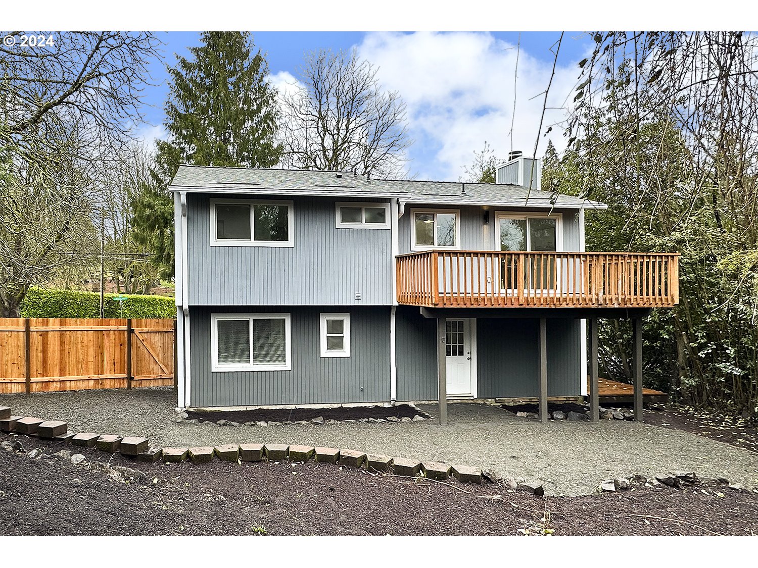 9109 Southwest Boones Ferry Road Portland, OR 97219 - Photo 22 of 22 a front view of a house with a garden