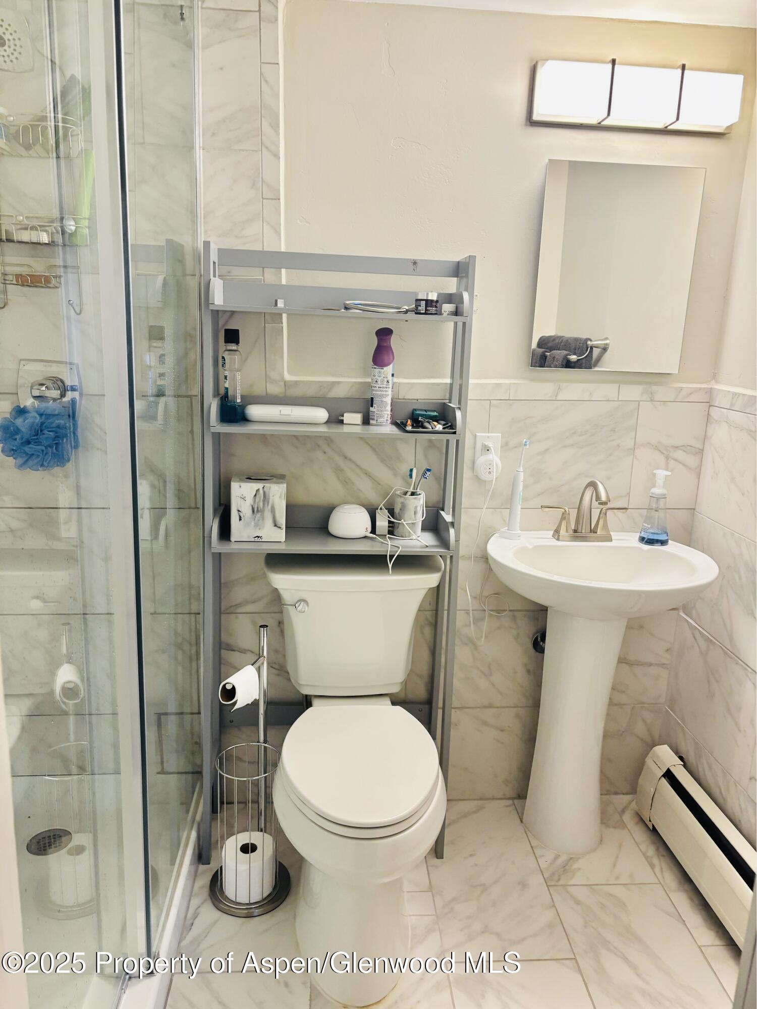 107 Aspen Mountain Road, Unit 4 Aspen, CO 81611 - Photo 8 of 8 a bathroom with a toilet sink and shower