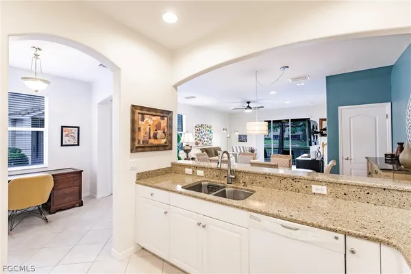 a kitchen with sink and couch
