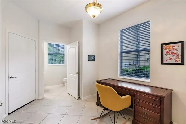 a view of a livingroom with furniture and a window