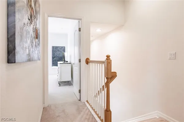 a view of a bathroom from a hallway