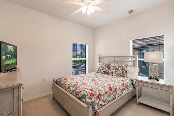 a bedroom with a bed and a dresser in it