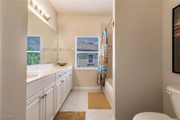 a bedroom with bed and window