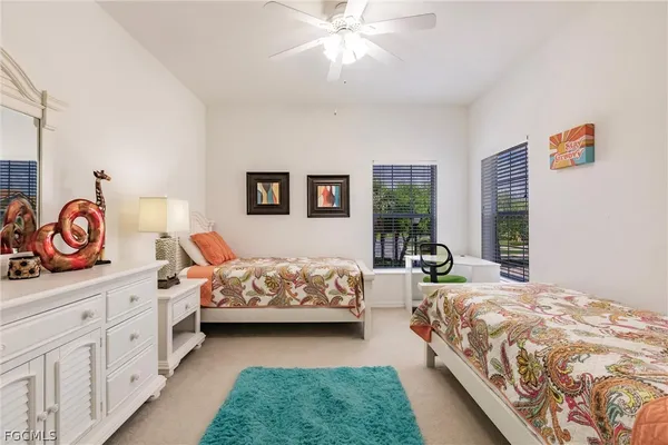 a bedroom with a bed and a dresser in it