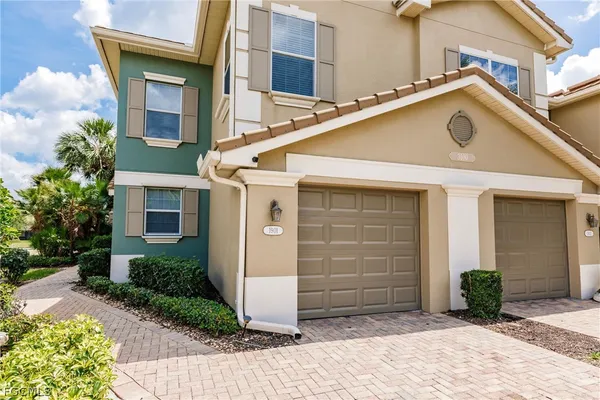 a front view of a house with garage