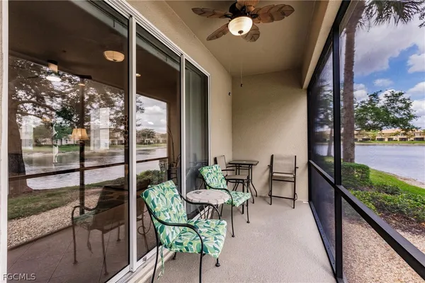 a balcony with furniture and garden view