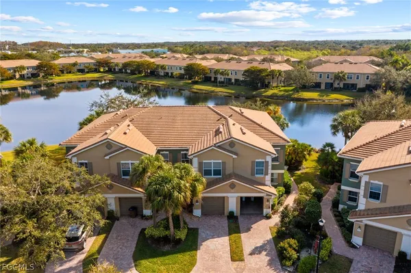 an aerial view of a house with a lake view