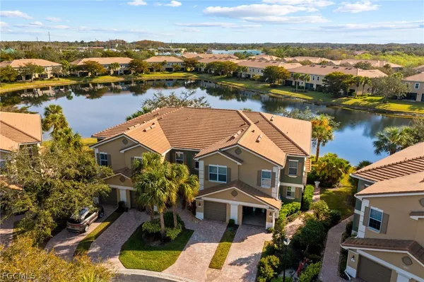 an aerial view of ocean and residential houses