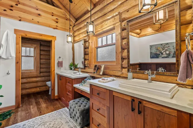 a kitchen with a sink appliances and cabinets