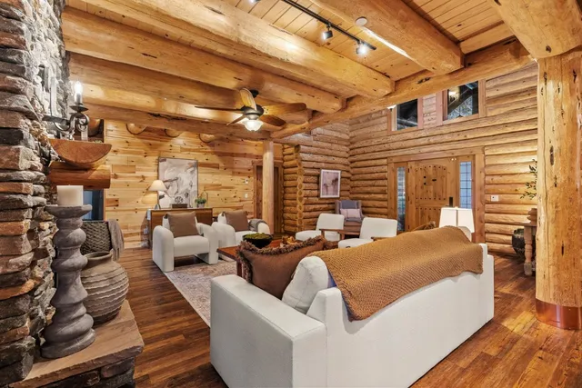 a balcony with furniture and a potted plant