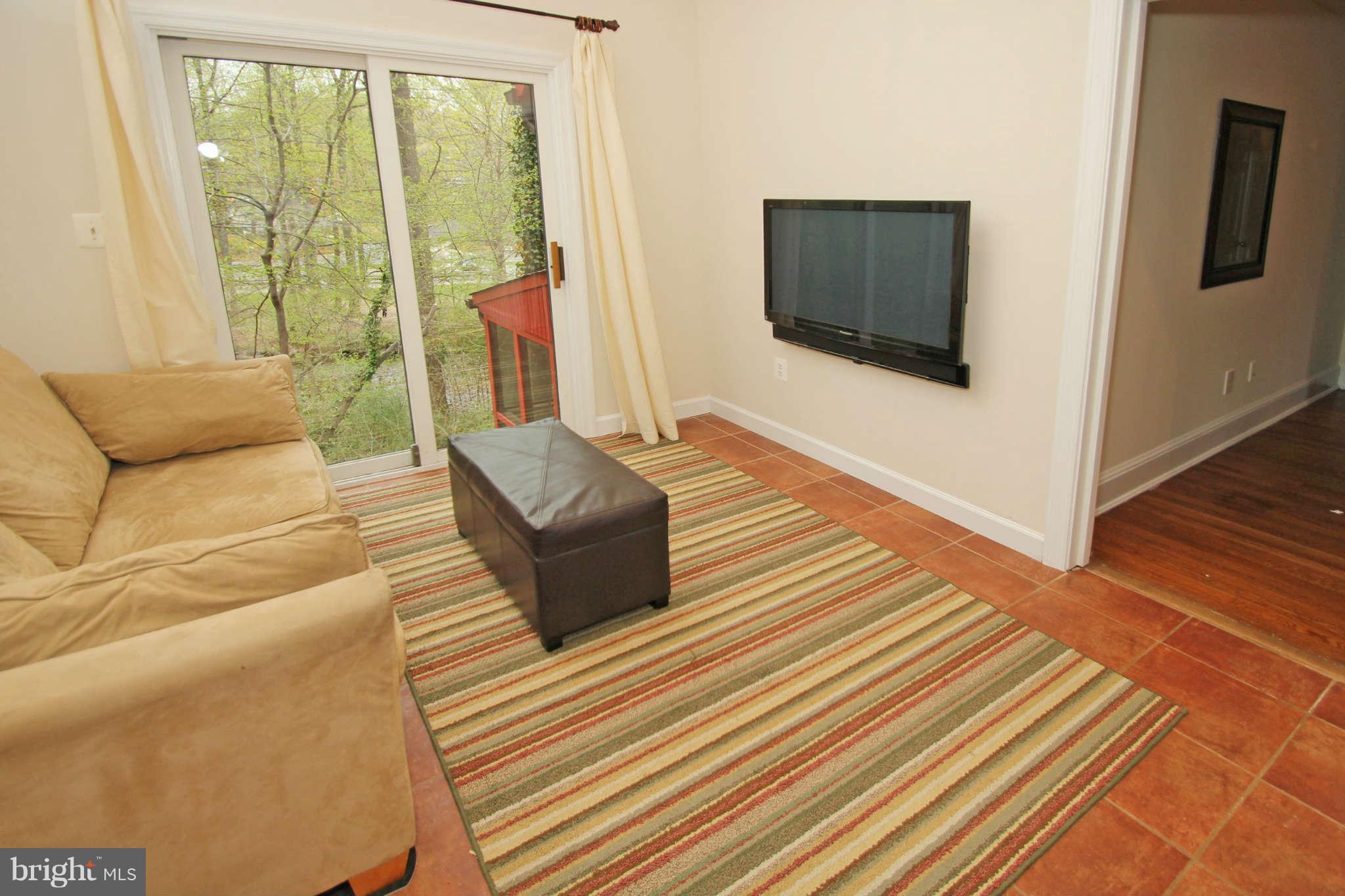 124 Hilltop Road Silver Spring, MD 20910 - Photo 8 of 29 Den with stunning tree-top view