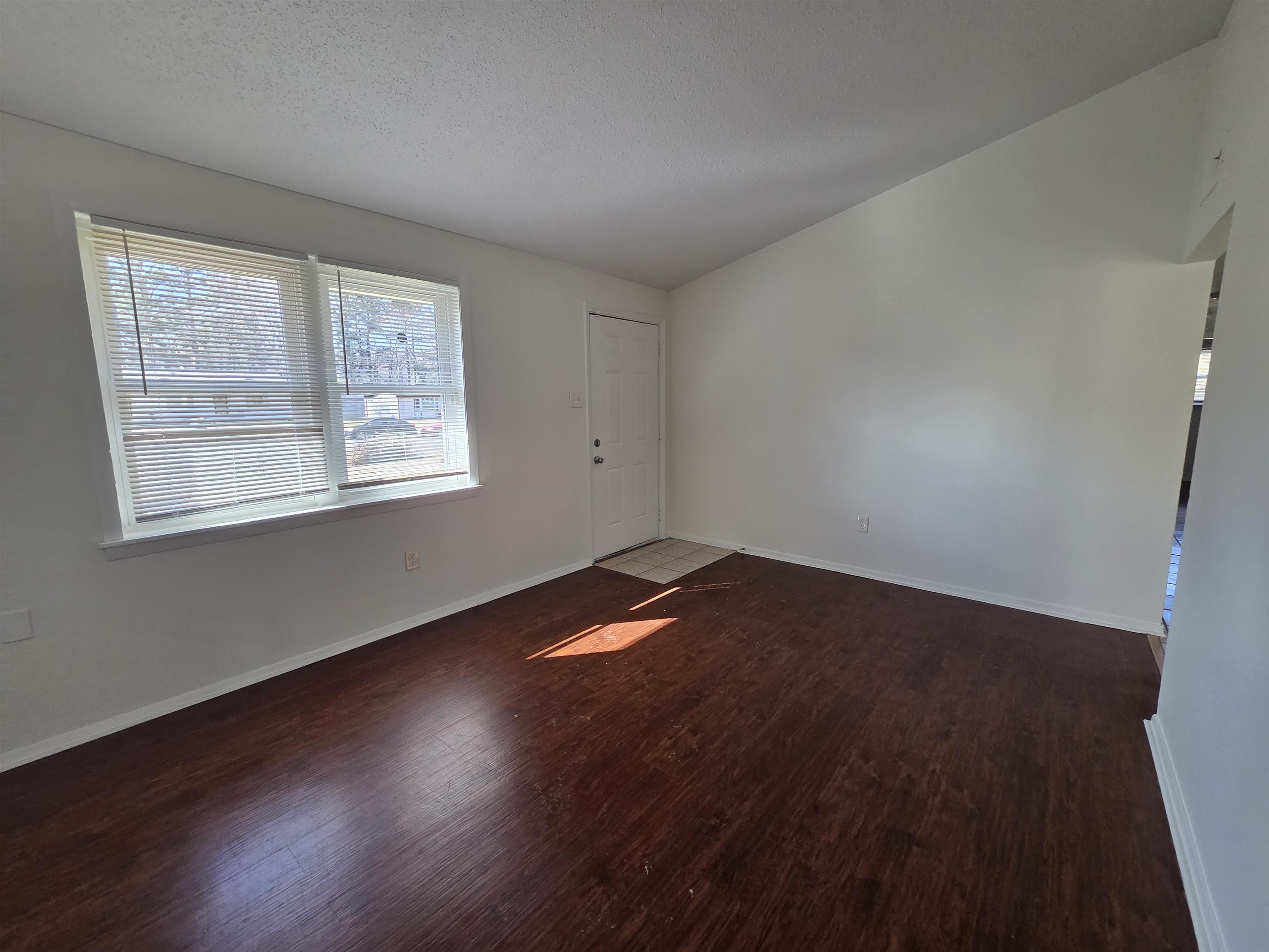 4638 Appleville Street Memphis, TN 38109 - Photo 11 of 23 a view of empty room with wooden floor and fan