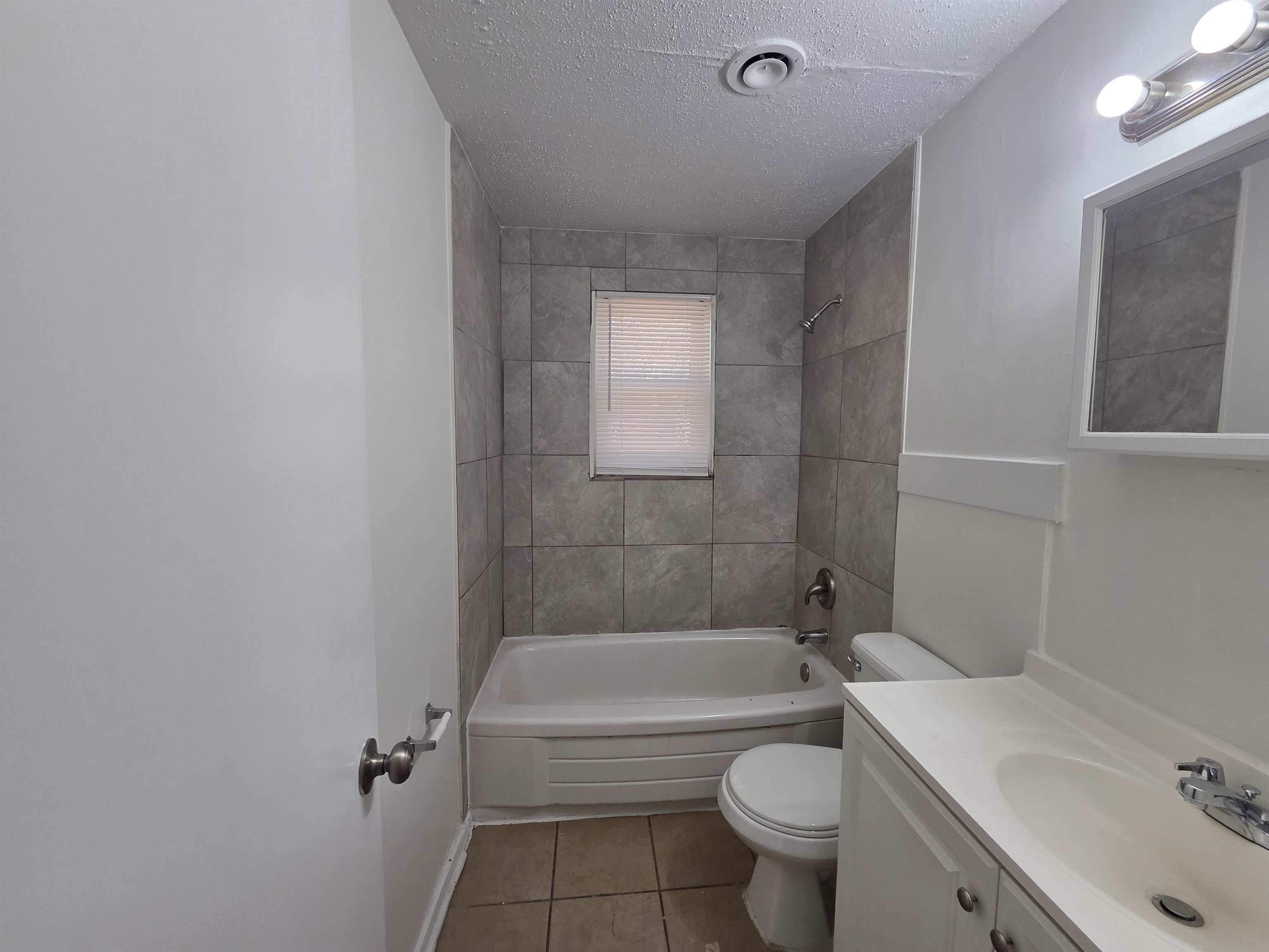 4638 Appleville Street Memphis, TN 38109 - Photo 20 of 23 a bathroom with a sink a toilet and shower