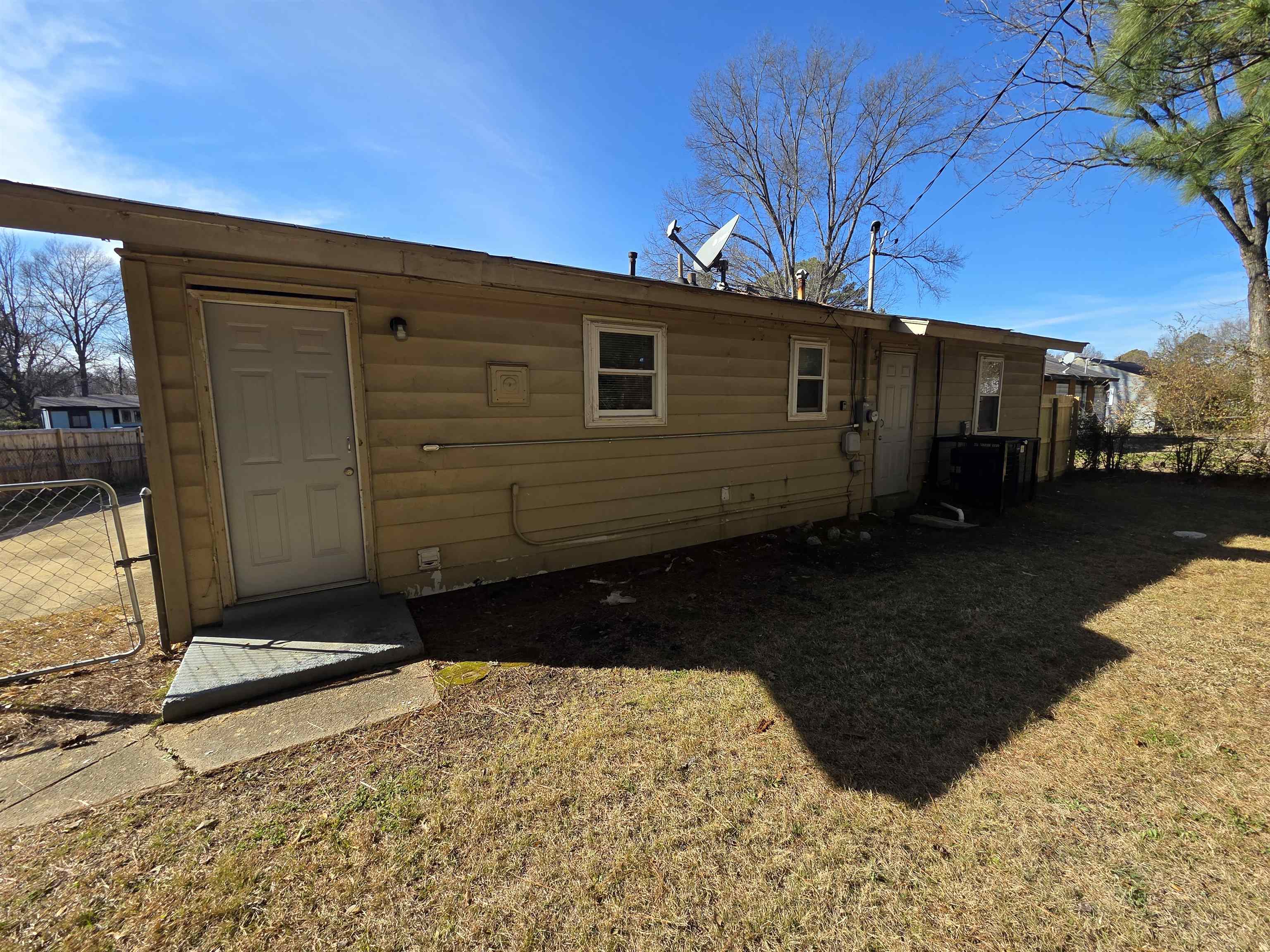 4638 Appleville Street Memphis, TN 38109 - Photo 21 of 23 a side view of a house with a yard
