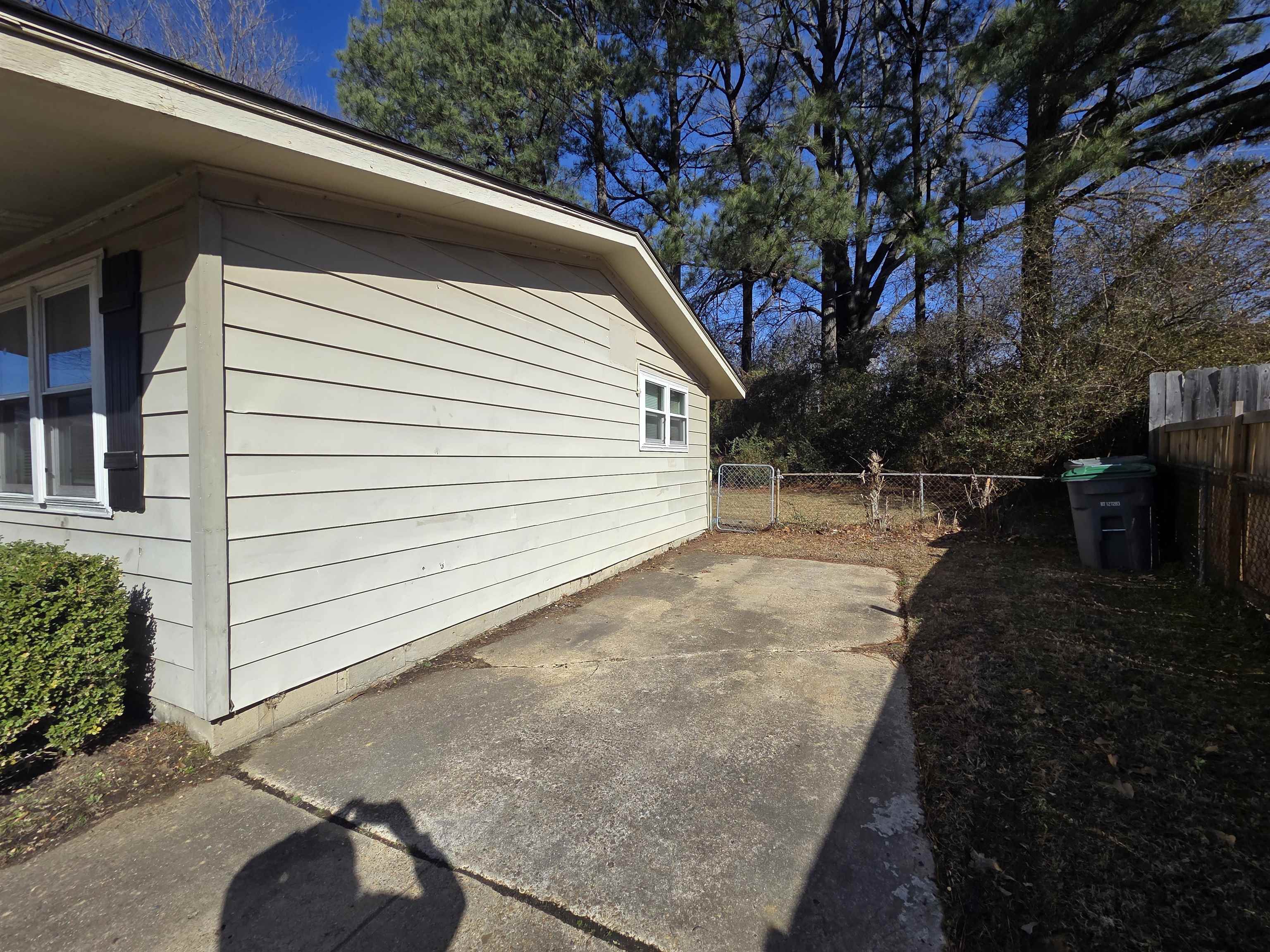 4638 Appleville Street Memphis, TN 38109 - Photo 23 of 23 a backyard of a house with lots of green space