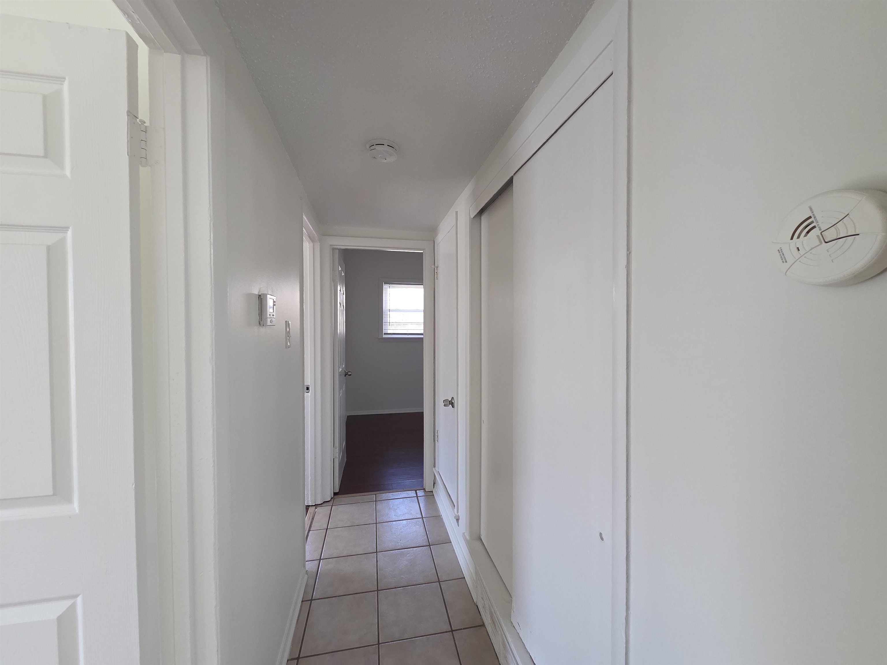 4638 Appleville Street Memphis, TN 38109 - Photo 3 of 23 a view of a hallway with wooden floor