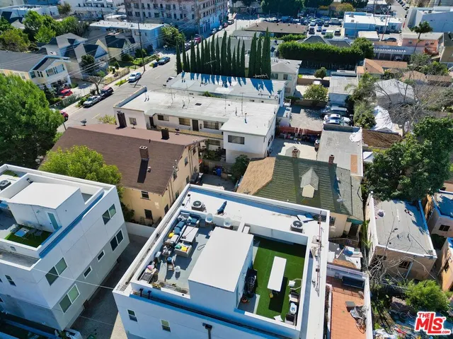 an aerial view of a house with a garden