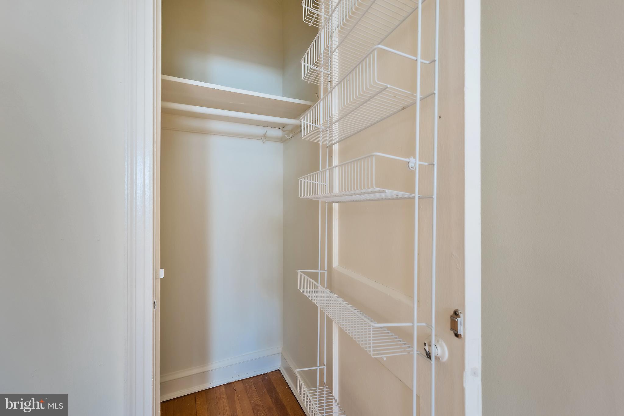 2341 40th Street Northwest, Unit 4 Washington, DC 20007 - Photo 19 of 21 a view of an empty walk in closet with wooden floor