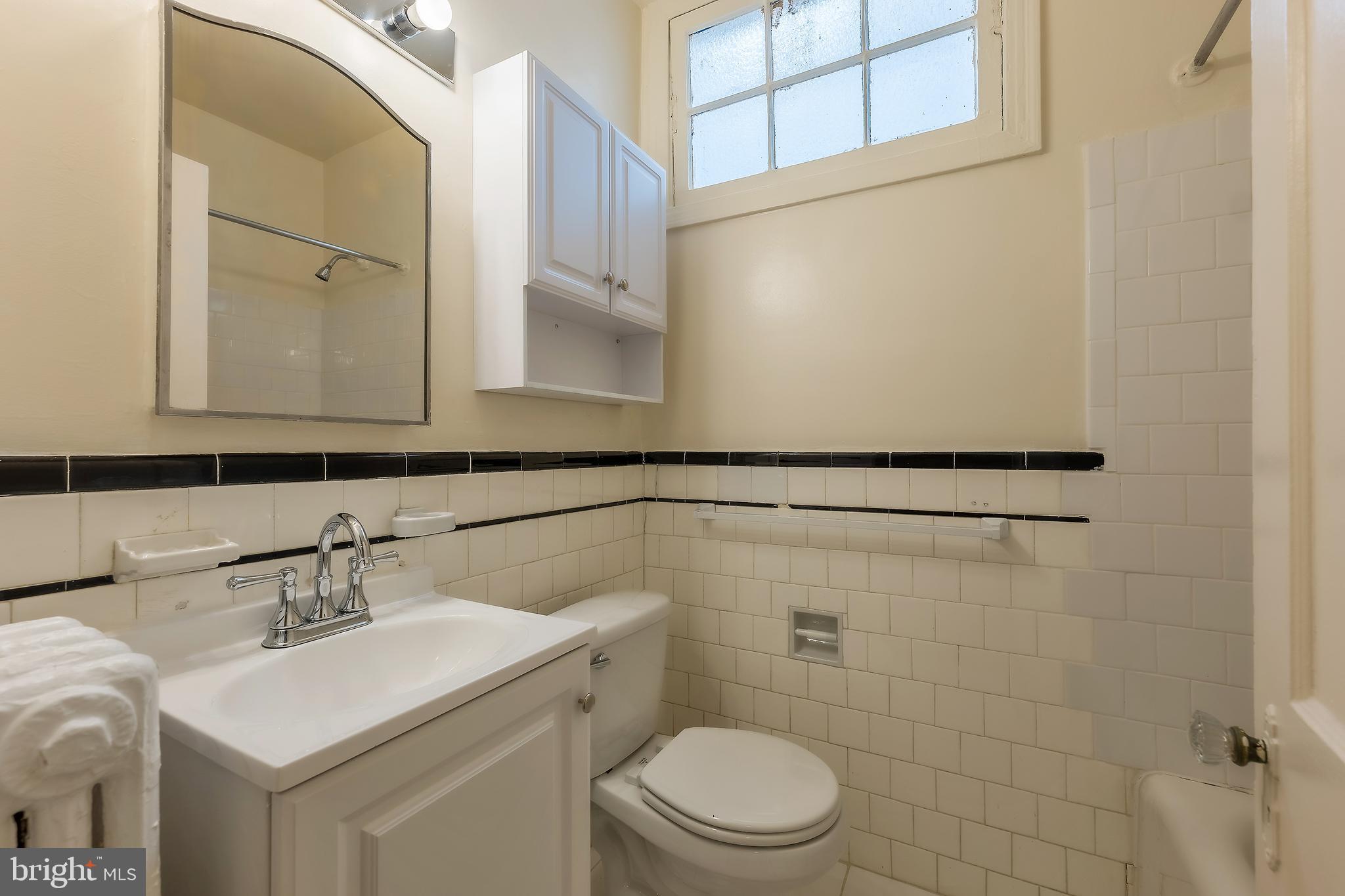 2341 40th Street Northwest, Unit 4 Washington, DC 20007 - Photo 20 of 21 a bathroom with a sink toilet and shower