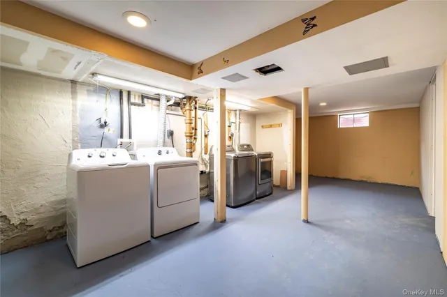 a utility room with washer and dryer