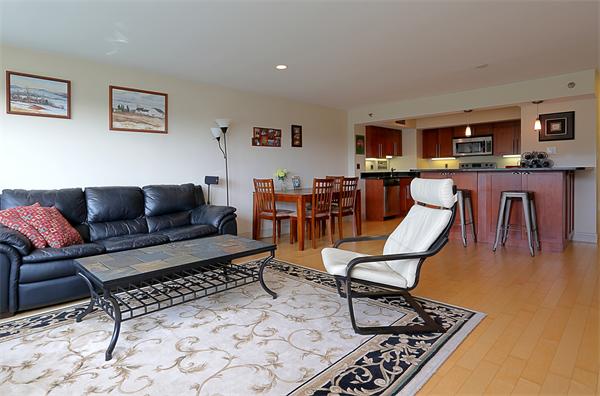 1600 Beacon Street, Unit 1002 Brookline, MA 02446 - Photo 2 of 7 a living room with furniture a rug and a table
