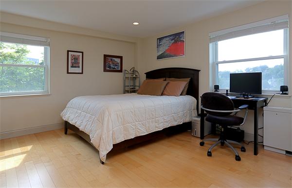 1600 Beacon Street, Unit 1002 Brookline, MA 02446 - Photo 4 of 7 a bedroom with a bed and a desk