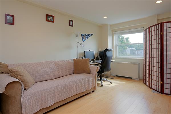 1600 Beacon Street, Unit 1002 Brookline, MA 02446 - Photo 5 of 7 a living room with furniture and a window