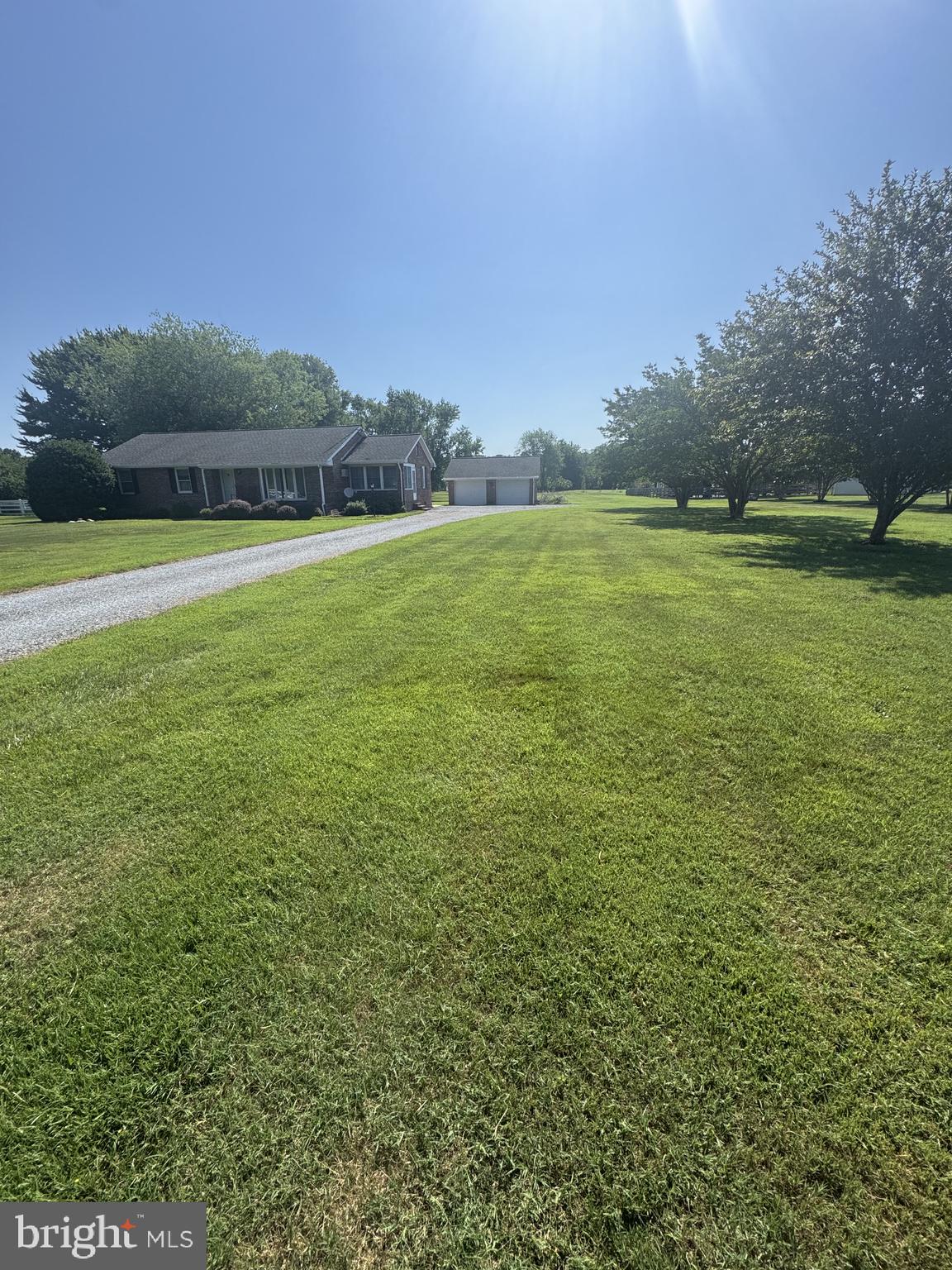 315 Bentons Pleasure Road Chester, MD 21619 - Photo 2 of 2 Spacious lawn under a clear sky.