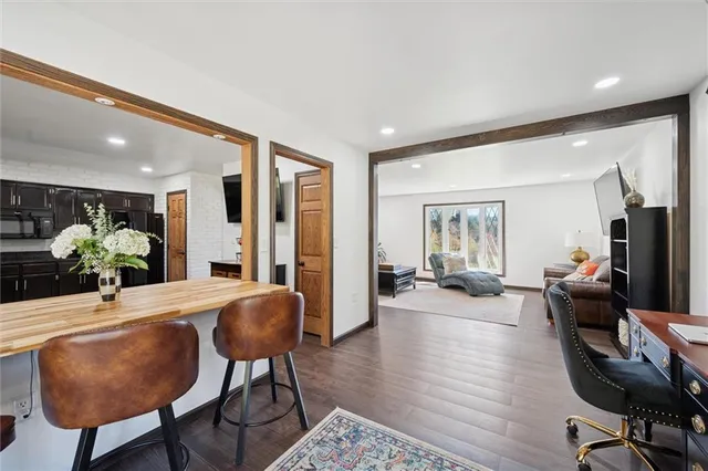a view of a dining room with furniture and wooden floor