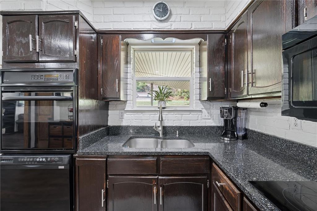 269 Boltz Road Cowansville, PA 16218 - Photo 18 of 38 a kitchen with granite countertop a sink cabinets and stainless steel appliances